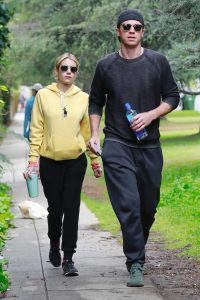 Emma Roberts in a Yellow Hoody
