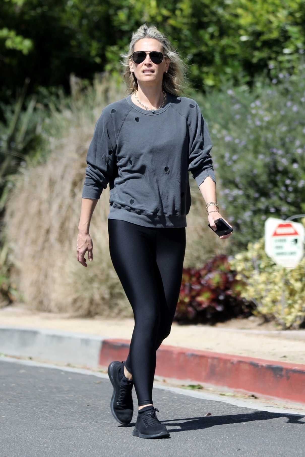 Molly Sims in a Black Sneakers