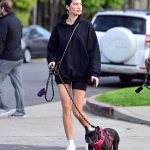 Nicole Williams in a White Sneakers Walks Her Dog Out with Larry English in LA 03/26/2020