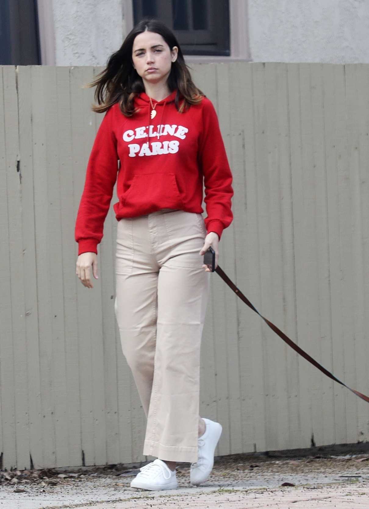 Ana De Armas in a Red Hoody Walks Her Dog in Pacific Palisades 04/11