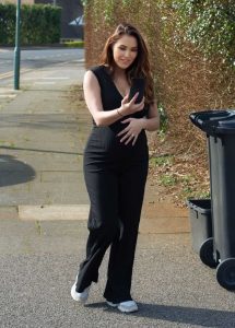 Chloe Goodman in a Black Jumpsuit