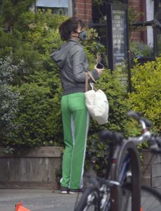Helena Christensen in a Neon Green Track Pants