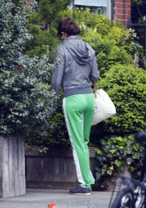 Helena Christensen in a Neon Green Track Pants