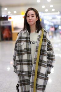 Janine Chang in a Plaid Coat