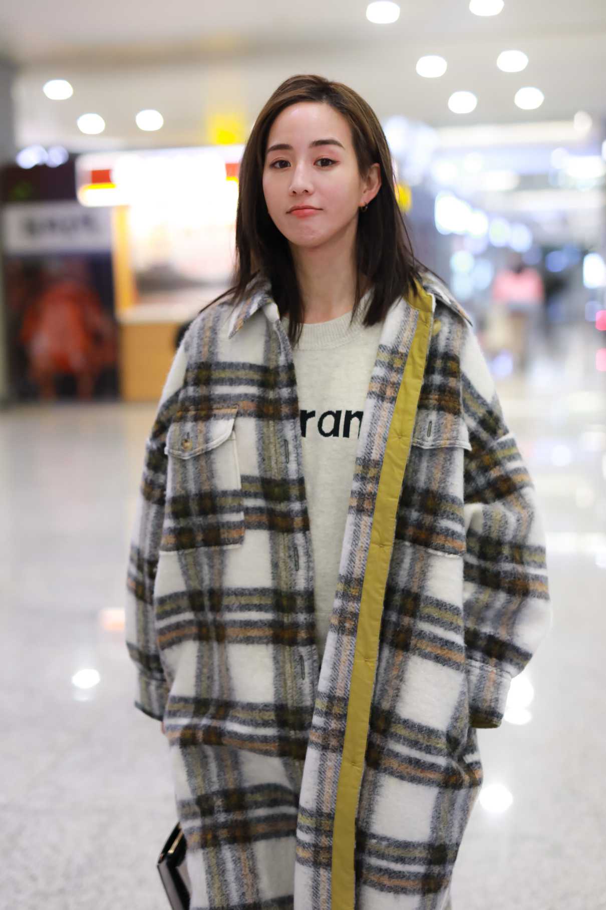 Janine Chang in a Plaid Coat Arrives at Airport in Shanghai 04/14/2020 ...