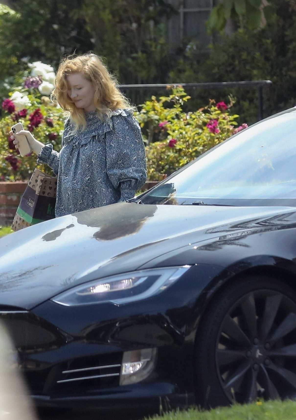 Kimberly Brook in a Blue Dress Returns After Picking up Food at