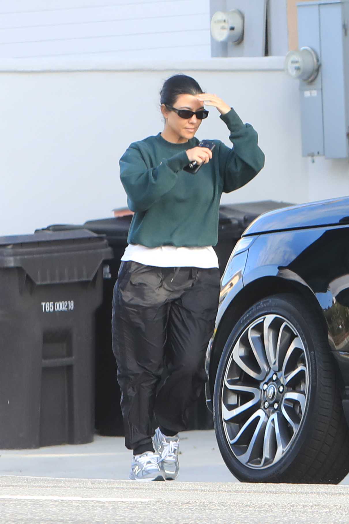 Kourtney Kardashian in a Green Sweatshirt