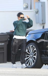 Kourtney Kardashian in a Green Sweatshirt