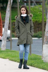 Lily Collins in a Black Rubber Boots