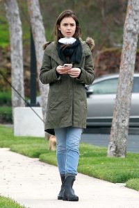 Lily Collins in a Black Rubber Boots