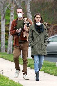 Lily Collins in a Black Rubber Boots