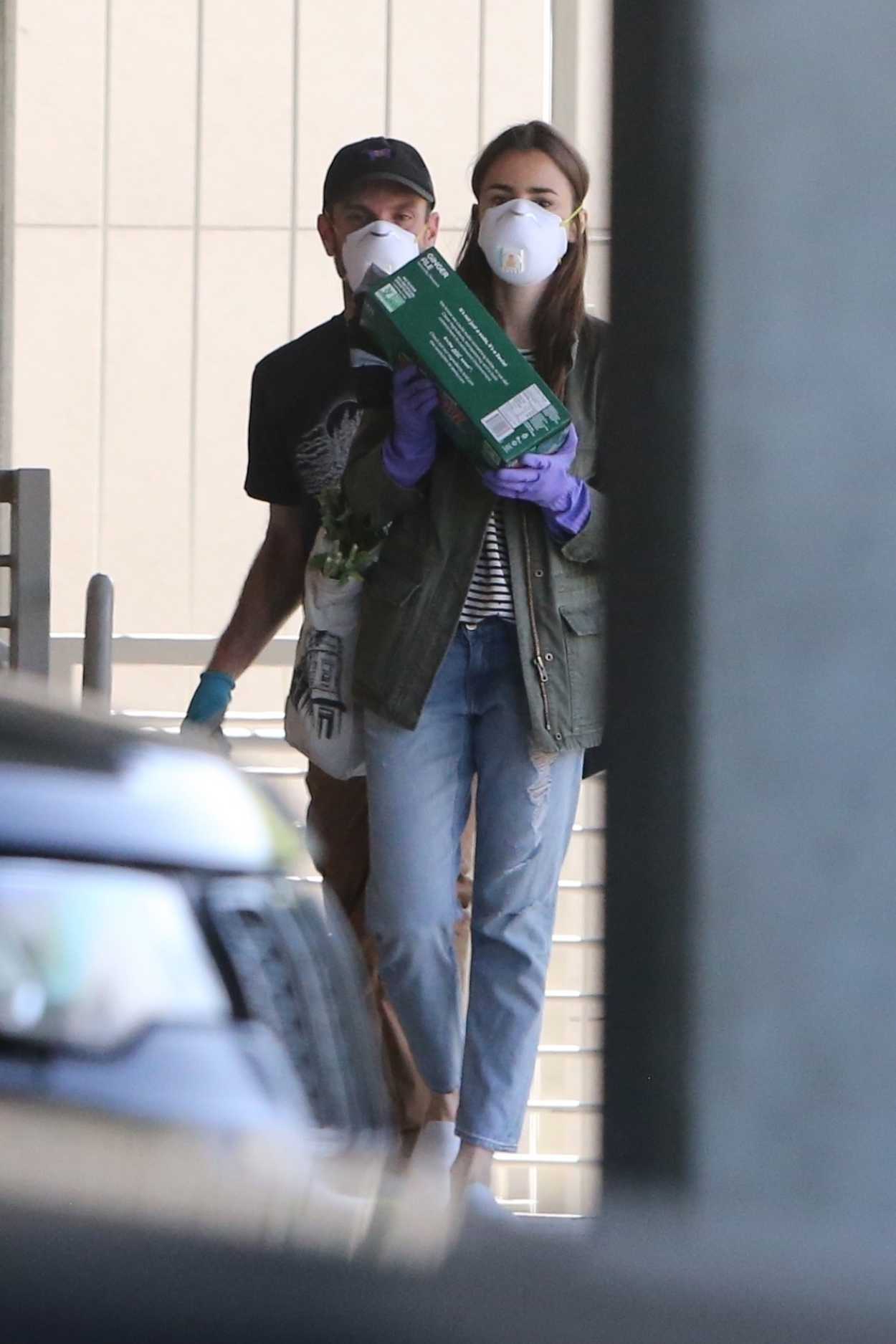 Lily Collins in a in a Surgical Face Mask
