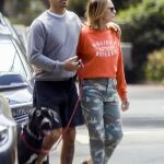 Robin Wright in an Orange Sweatshirt Walks Her Dog Out with Clement Giraudet During the COVID-19 Lockdown in Santa Monica 04/28/2020