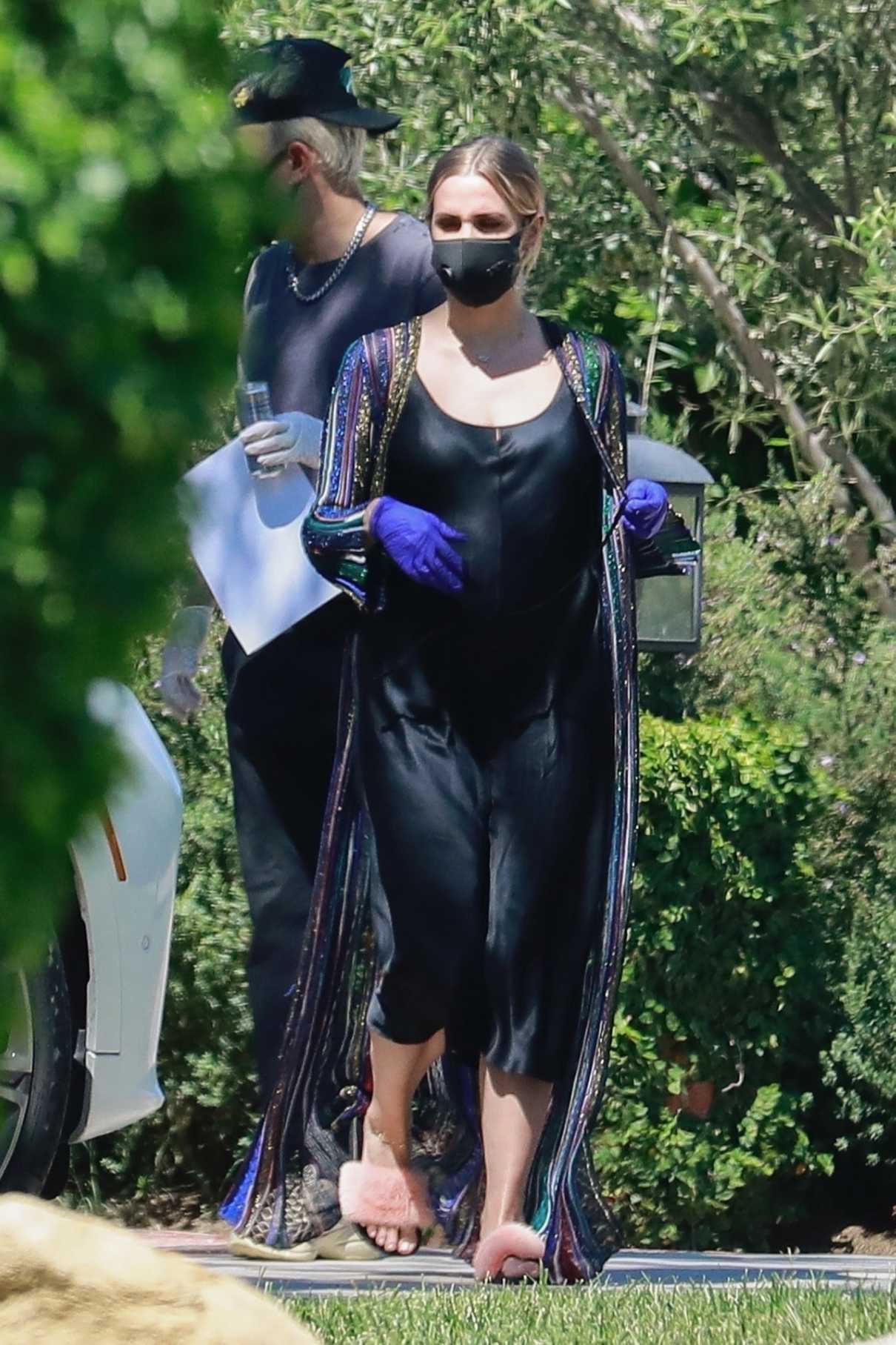 Ashlee Simpson in a Black Protective Mask