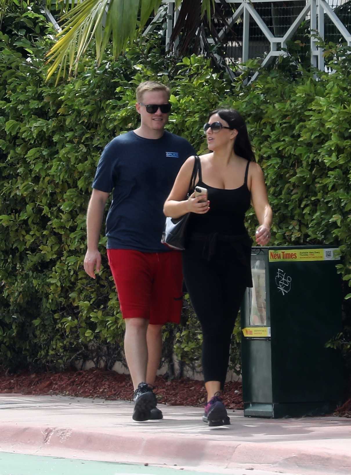 Claudia Romani in a Black Top Was Seen Out with Chris Johns in Miami 05