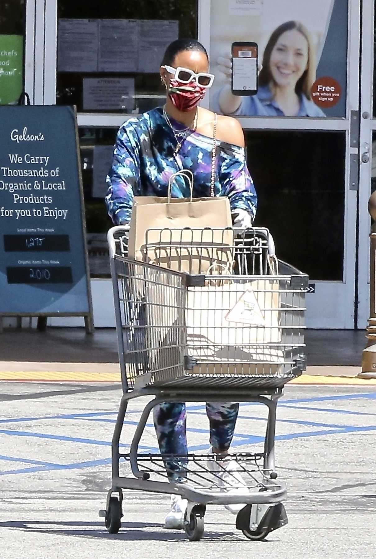 Kelly Rowland in a Protective Mask