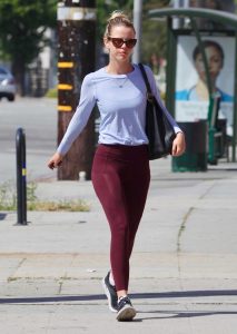 Mia Goth in a Purple Leggings