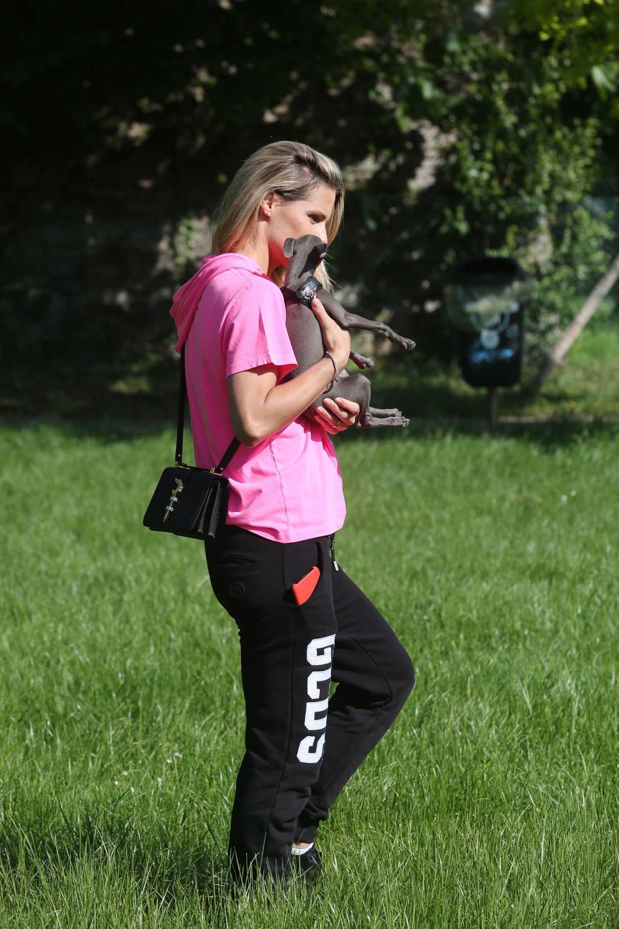 Michelle Hunziker in a Pink Tee