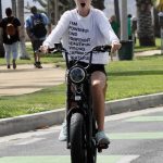 Abby Champion in a White Sweatshirt Does a Bike Ride Out with Patrick Schwarzenegger in Santa Monica 06/19/2020