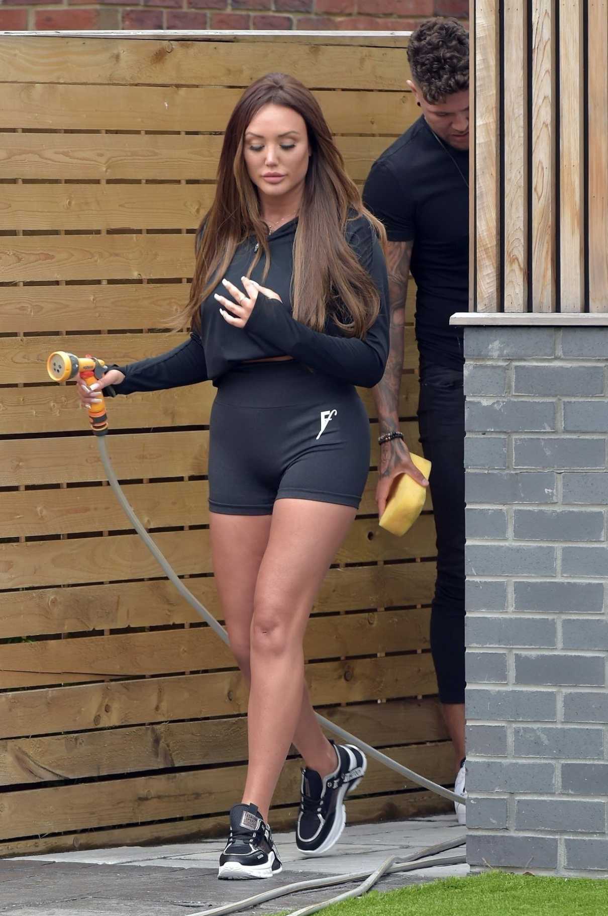 Charlotte Crosby in a Black Spandex Shorts Washes Her Car Out with