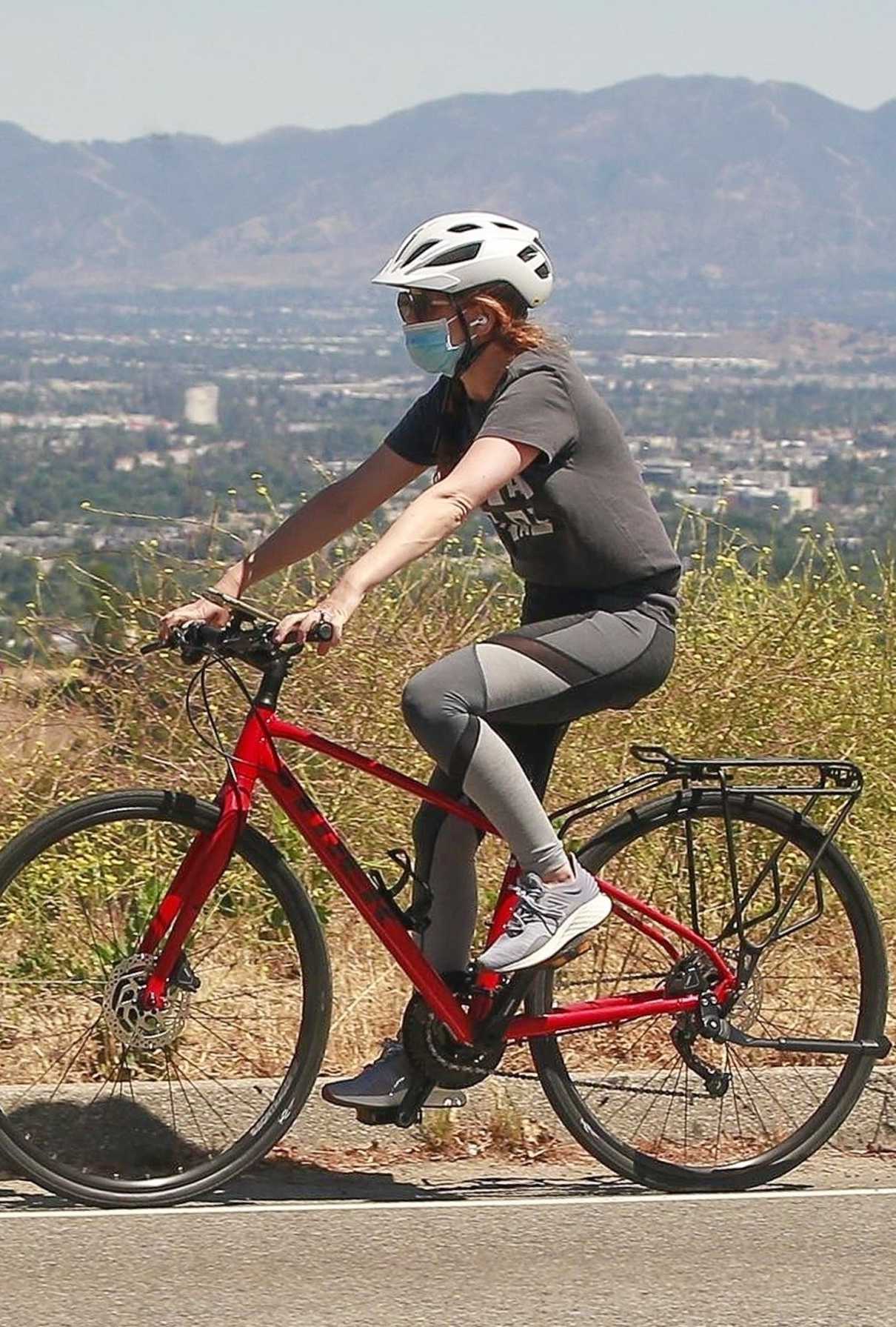 Isla Fisher in a Blue Protective Mask Does a Bike Ride in Los Angeles