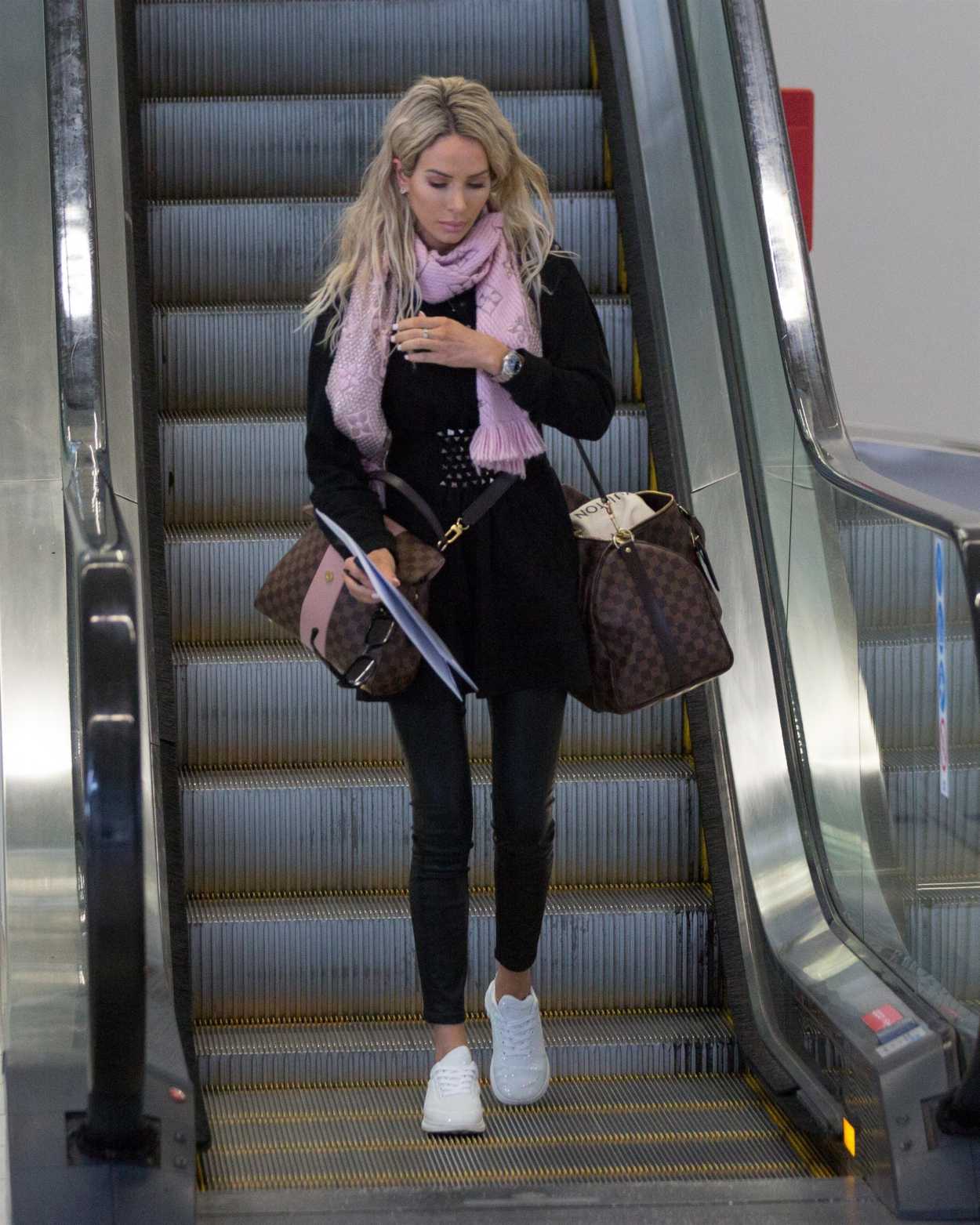 Stacey Hampton in a Black Dress Arrives in Melbourne 05/31/2020