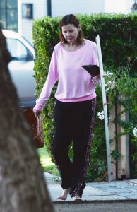Geena Davis in a Pink Sweatshirt