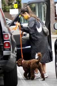Jordana Brewster in a Black Raincoat