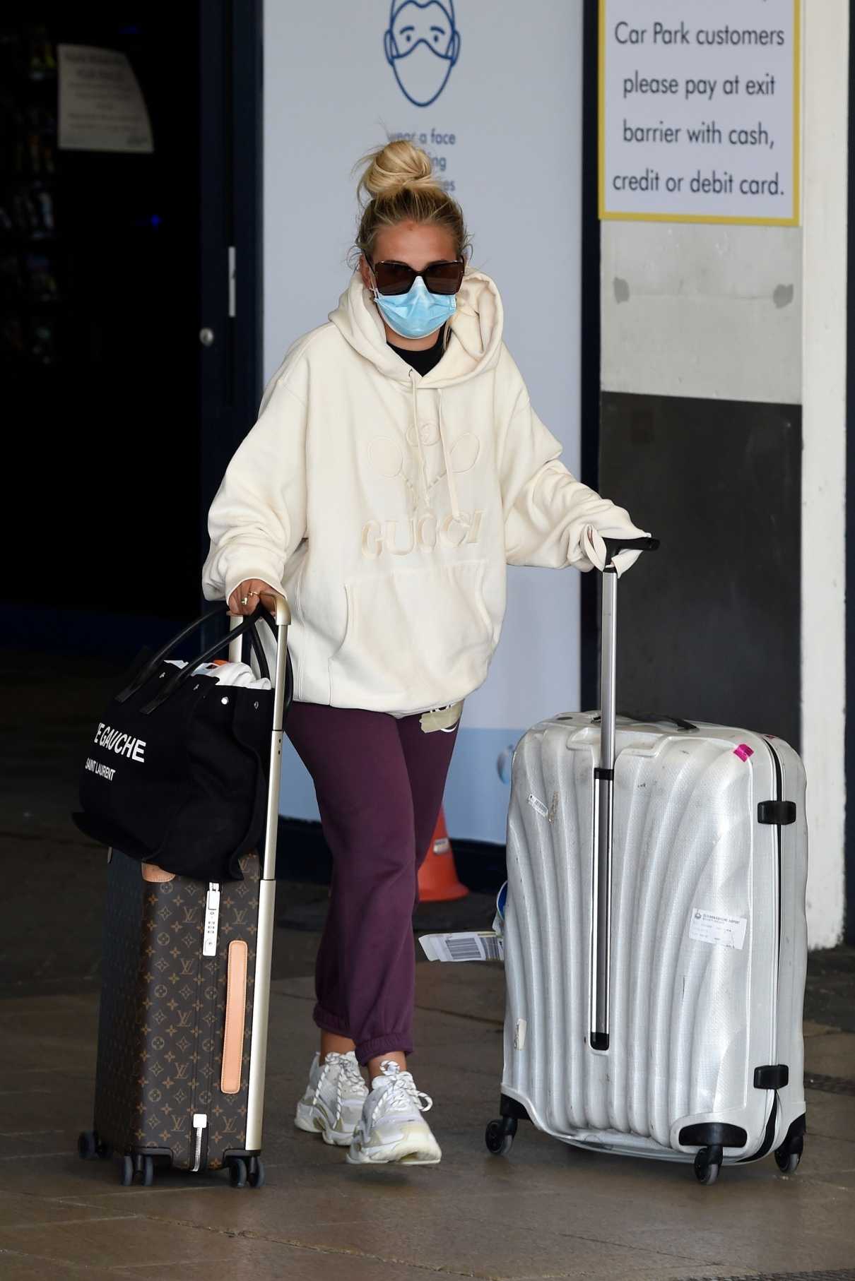 Molly-Mae Hague poses with £4k designer luggage in the airport