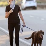 Patsy Palmer in a Black Cap Walks Her Dog in Malibu 07/25/2020
