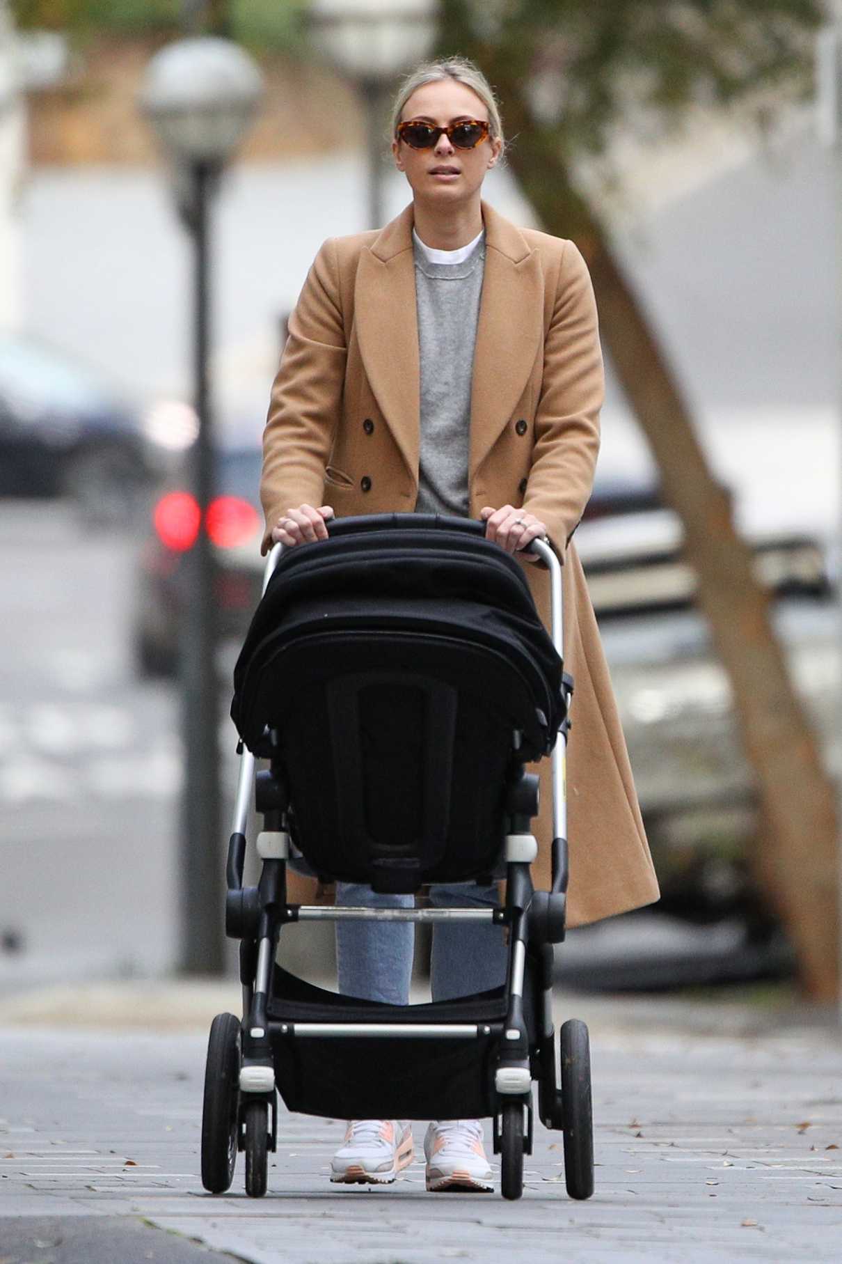 Sylvia Jeffreys in a Tan Coat