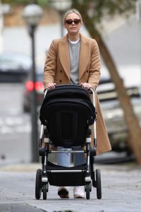 Sylvia Jeffreys in a Tan Coat