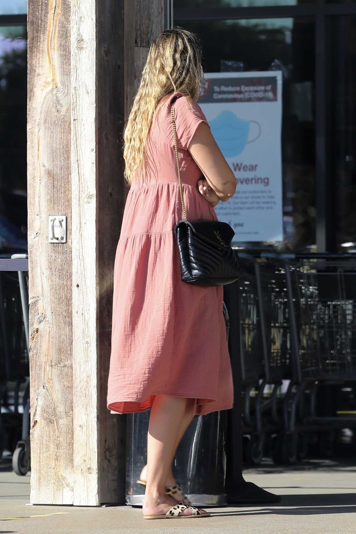 April Love Geary in a Pink Dress