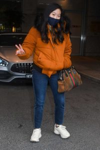 Awkwafina in an Orange Jacket