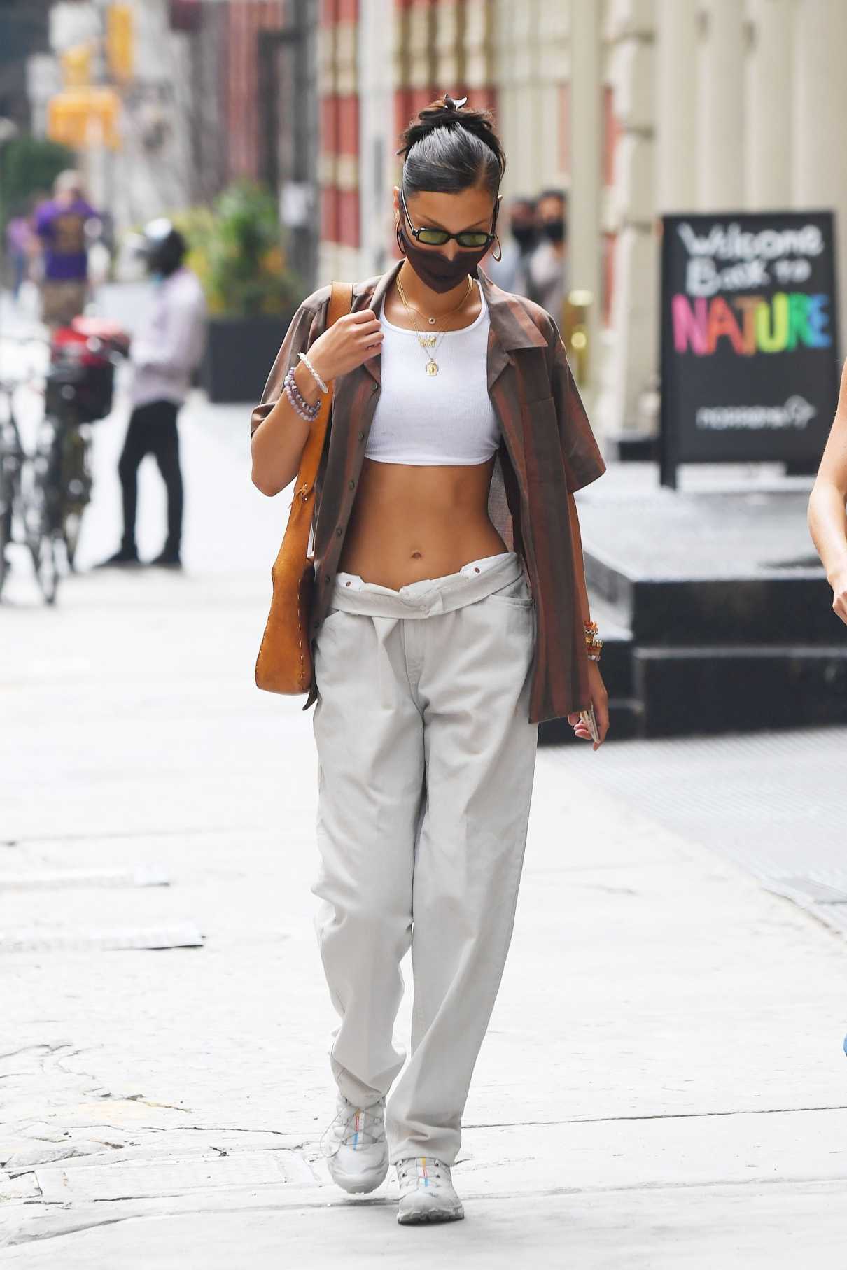 Bella Hadid in a White Sports Bra Goes Shopping with a Friend in New ...