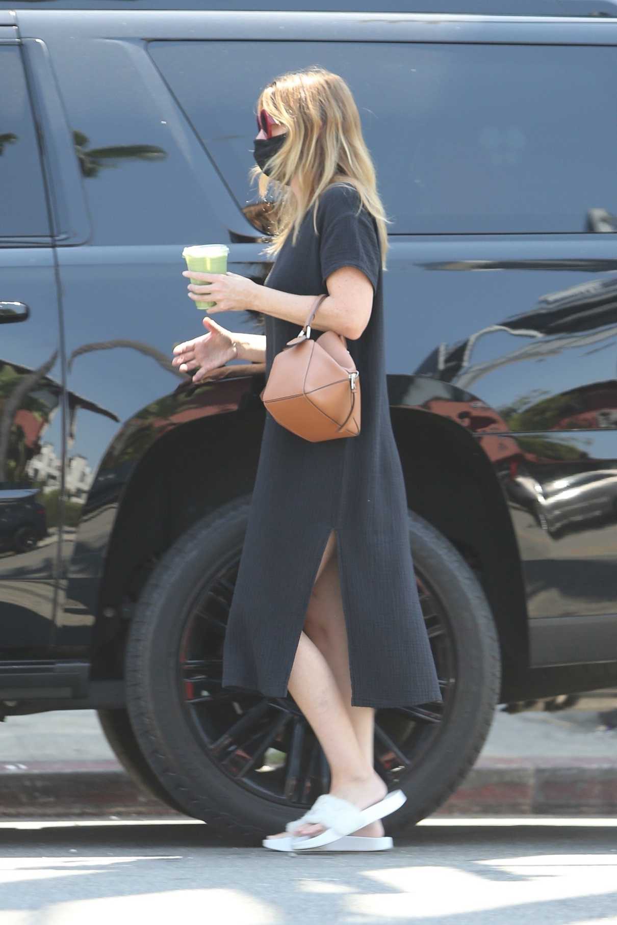 Ellen Pompeo in a Black Dress Grabs a Green Smoothie in Los Feliz 08/16