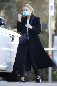 Phoebe Burgess in a Protective Mask