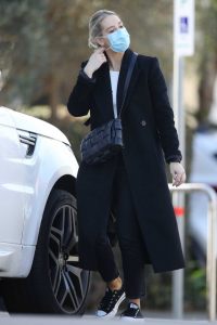 Phoebe Burgess in a Protective Mask