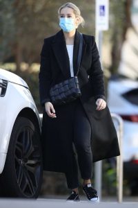 Phoebe Burgess in a Protective Mask