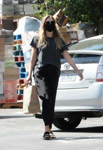 Elizabeth Olsen in a Black Protective Mask