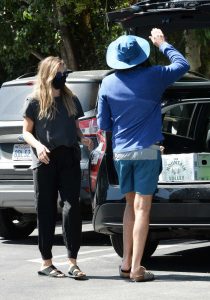 Elizabeth Olsen in a Black Protective Mask