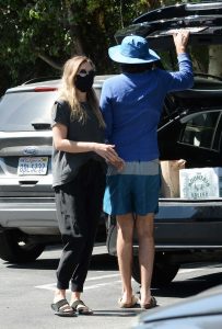 Elizabeth Olsen in a Black Protective Mask