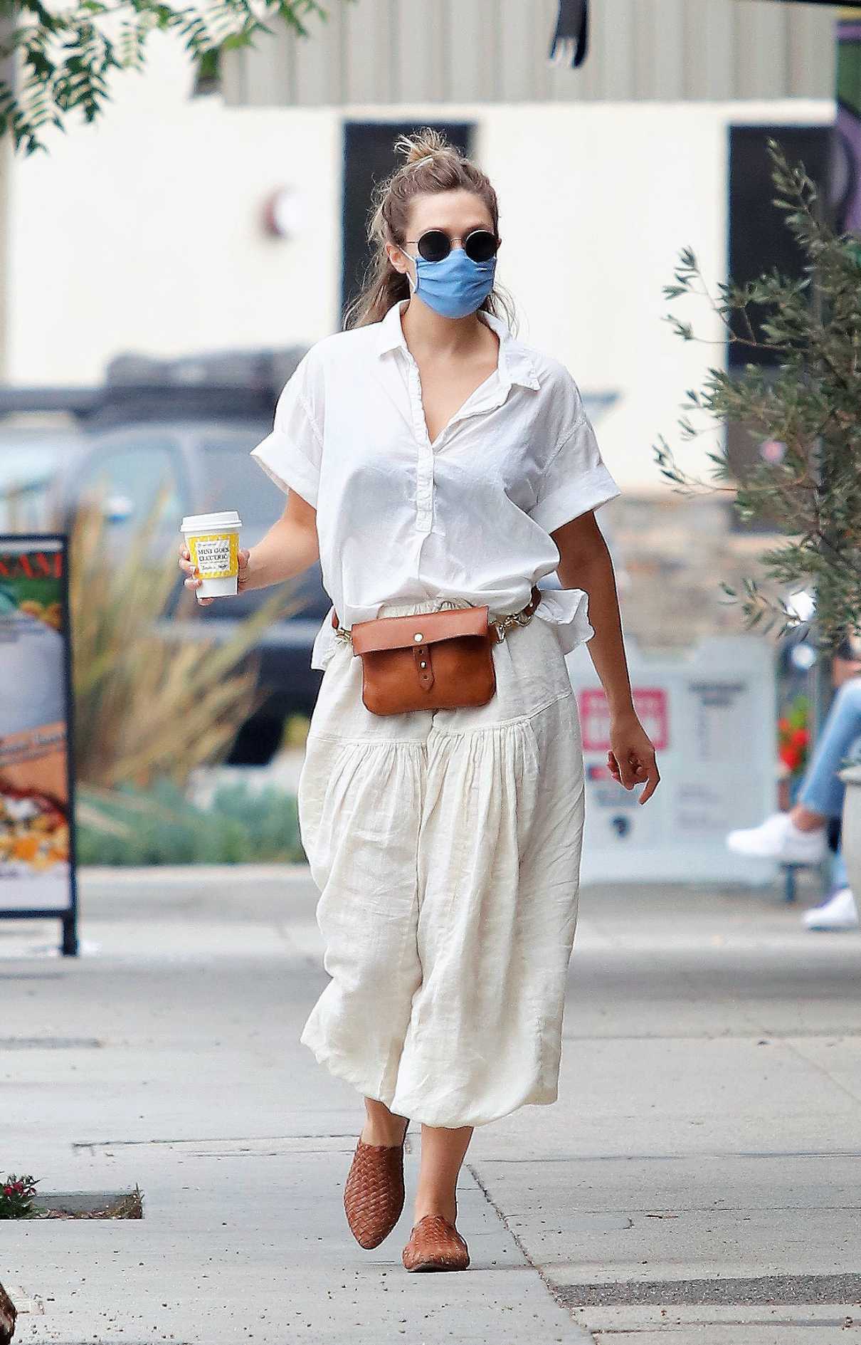 Elizabeth Olsen in a Protective Mask