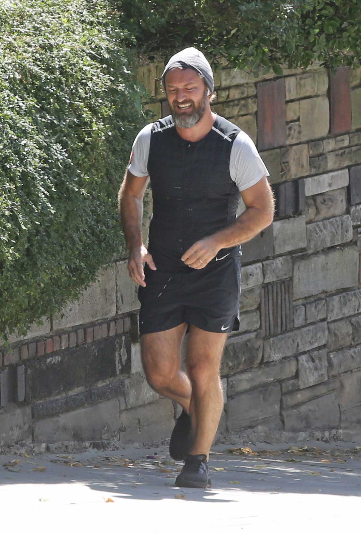 Jude Law in a Black Sneakers