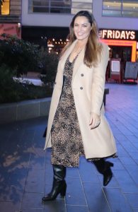 Kelly Brook in a Beige Coat