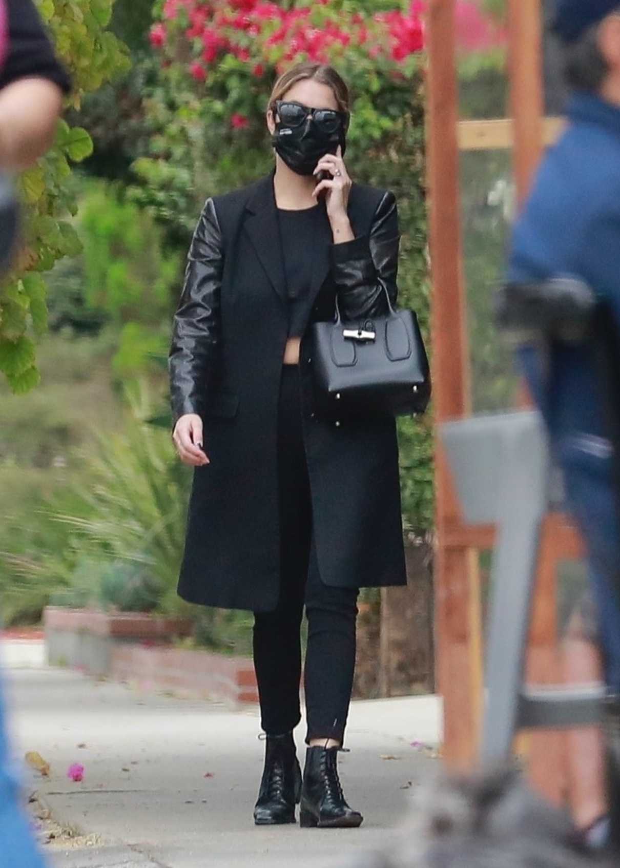 Ashley Benson in a Black Coat