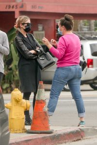 Ashley Benson in a Black Coat