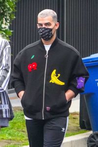 Joe Jonas in a Black Sweatshirt