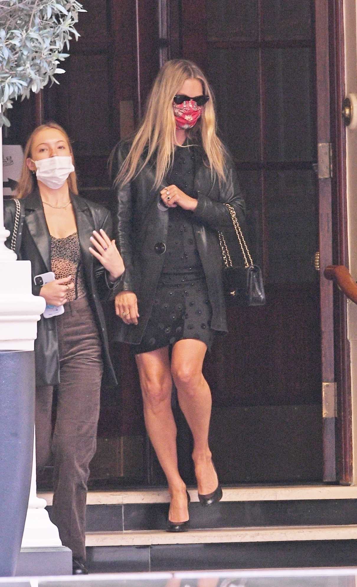 Kate Moss in a Red Protective Mask