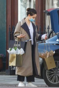 Lily James in a Beige Trench Coat